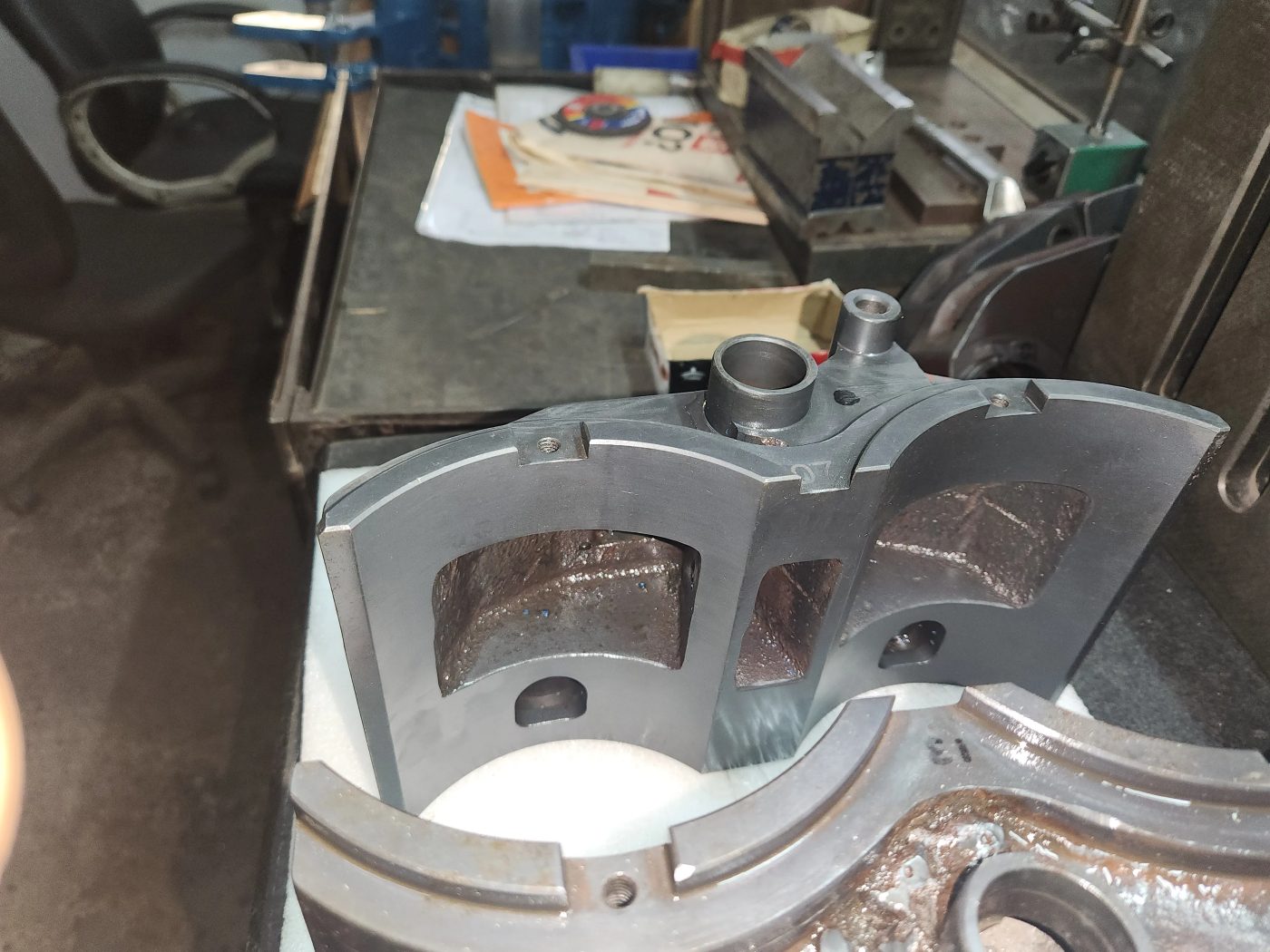 A machined insert assembly on the bench at the KVG works